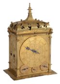 A fine German gilt brass quarter striking table clock with annual calendar...   A fine German gilt