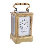 A French lacquered brass miniature carriage timepiece Retailed by W   A French lacquered brass