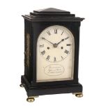 A William IV small ebonised table clock Dwerrihouse, Ogston and Bell, London   A William IV small