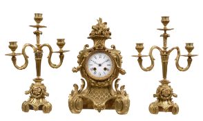 A French Louis XV style gilt brass mantel clock garniture The movement by...   A French Louis XV
