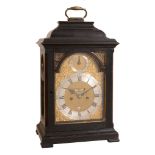 A fine George III ebonised table clock with pull-quarter repeat on six bells...   A fine George