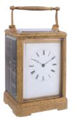 A fine French engraved gilt brass carriage clock Auguste, Paris   A fine French engraved gilt