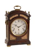 A fine George III brass mounted figured mahogany quarter chiming table clock...   A fine George