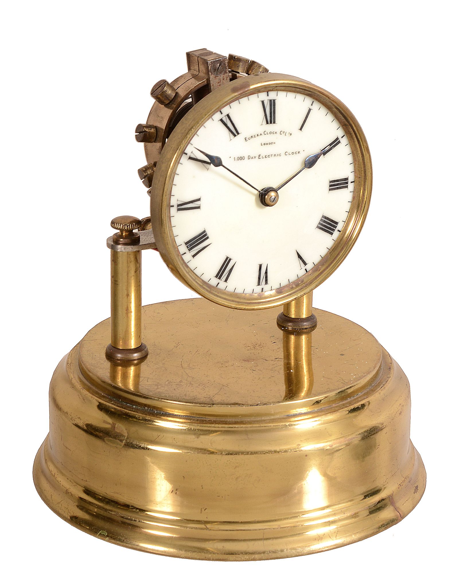 A brass electromagnetic balance mantel timepiece Eureka Clock Company Limited   A brass