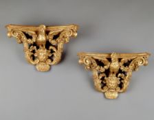 A Pair of French Carved Giltwood Brackets one Ré gence, the other of a later date, each carved as