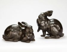 A Pair of 19th Century Japanese Bronze Rabbits one modelled lying down and the other alert with