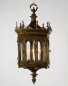 A Pair of 19th Century Renaissance Revival Bronze Hanging Lanterns each face with a rounded arch