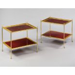 A Pair of Two Tier Tables With Red Leather Tops A Pair of Two Tier Tables With Red Leather Tops
