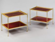 A Pair of Two Tier Tables With Red Leather Tops A Pair of Two Tier Tables With Red Leather Tops