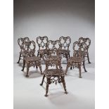 A Set of Eight 19th Century Cast Iron Garden Chairs in a rich patinated bronze colour, the heart-