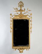 A Pair of George III Neo-Classical Giltwood Mirrors each surmounted by a vase issuing a pierced