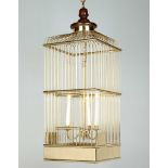 A Brass Bird Cage Lantern with a central three light candelabra, the top with a turned wooden finial