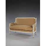 A Louis XVI Neo-Classical Carved Settee in the manner of Claude Sené , the frame finely carved