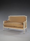 A Louis XVI Neo-Classical Carved Settee in the manner of Claude Sené , the frame finely carved