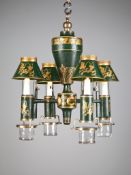 A Charles X Tole Chandelier in green with gilt decoration, retaining the original glass drip pans,