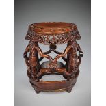 A 19th Century Carved Chinese Hardwood Seat of open-sided ºrrel' type with prunus, bird and flower-