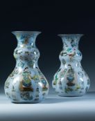 A Large Pair of Decalcomania Vases of baluster shape, profusely decorated with polychrome