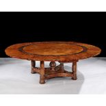 A Large Regency Mahogany Circular Extending Dining Table in the Manner of George Bullock the