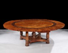 A Large Regency Mahogany Circular Extending Dining Table in the Manner of George Bullock the