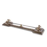 A 19th Century Brass and Steel Fender the rail supported by decorative brass uprights at each end to