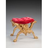 A 19th Century Carved Giltwood Stool in the manner of Henry Williams, of curule form, decorated with