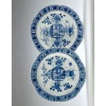A Pair of Kangxi Blue and White Chargers each with a central medallion surrounded by flowers of