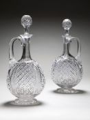 A Pair of Cut Glass Decanters with fine hobnail and diamond cut decoration, with their original