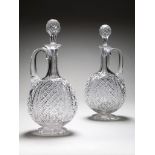 A Pair of Cut Glass Decanters with fine hobnail and diamond cut decoration, with their original