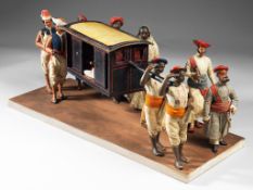 A 19th Century Anglo-Indian model of a Palanquin together a group of attendant figures , 50.8cm