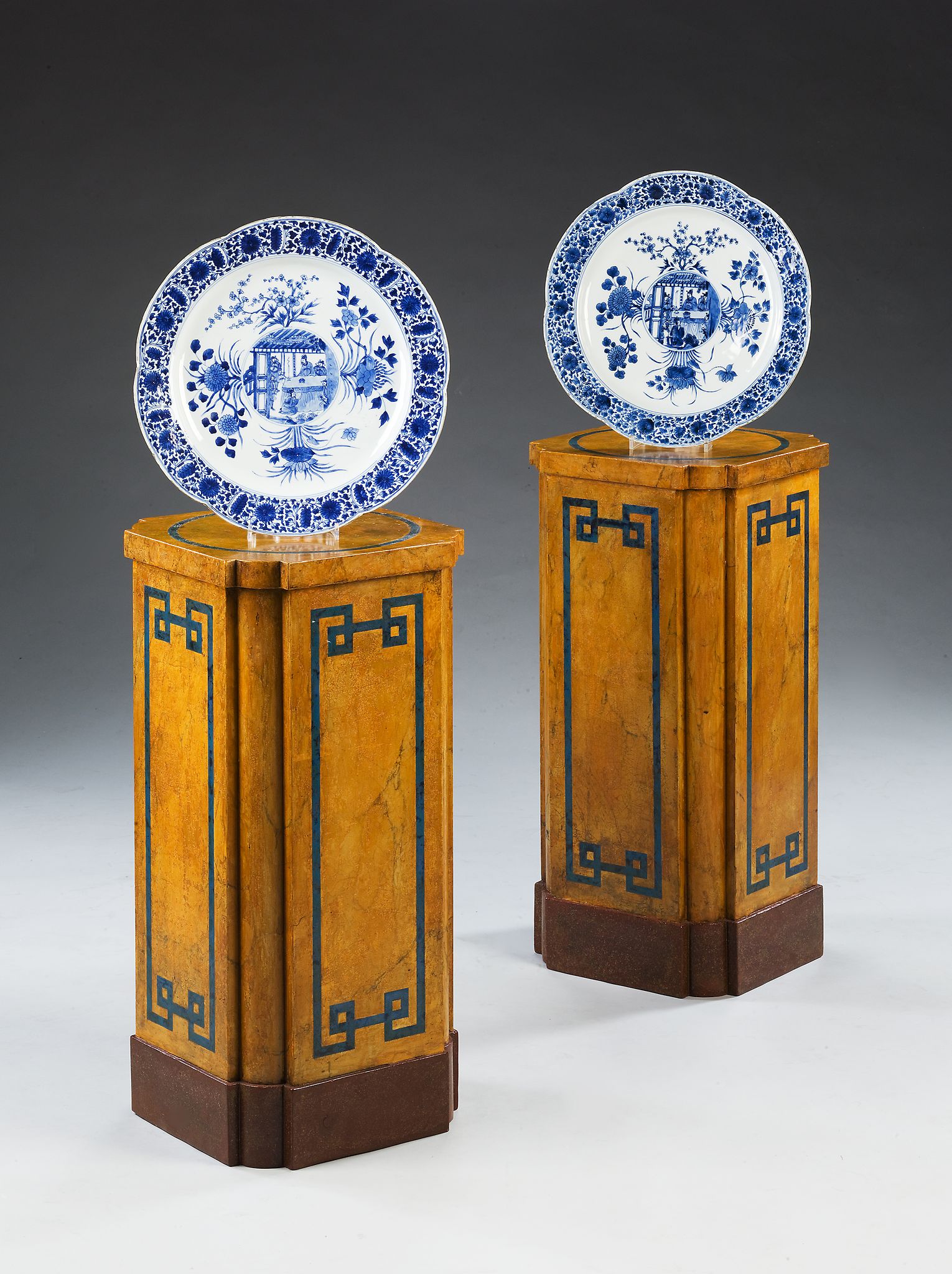 A Pair of 19th Century Pedestals with shaped corners, decorated to simulate yellow marble and with a