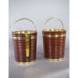 A Pair of Irish Georgian Mahogany Buckets one for peat and one for plates, the reeded brass bound,