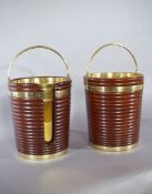 A Pair of Irish Georgian Mahogany Buckets one for peat and one for plates, the reeded brass bound,
