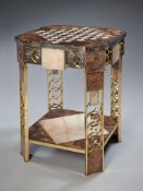 An Art Deco Marble and Onyx Table with octagonal shaped top, decorated with a chequer board of