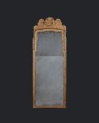 A George I Giltwood Pier Glass the frame carved with delicate leaf motifs, bell flowers and stylised