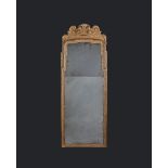 A George I Giltwood Pier Glass the frame carved with delicate leaf motifs, bell flowers and stylised