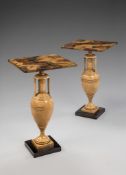 A Pair of Painted Occasional Tables with simulated marble tops, on turned urn shaped bases, 46.5cm