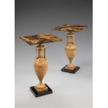 A Pair of Painted Occasional Tables with simulated marble tops, on turned urn shaped bases, 46.5cm