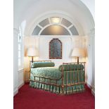 A 19th Century French Iron Campaign Bed the frame painted to simulate bamboo, with gilded scrolls