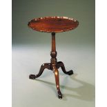 A George III Mahogany Tripod Table with piecrust top, raised on a turned stem with spiral knop, on