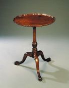 A George III Mahogany Tripod Table with piecrust top, raised on a turned stem with spiral knop, on