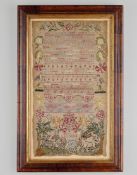 An Early 18th Century Band Sampler worked with the Lord's Prayer, numerals, crowns, honeysuckle