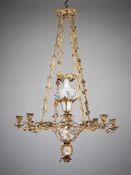 A Mid 19th Century French Ormolu and Opaline Chandelier Suspended by four stylized foliate chains