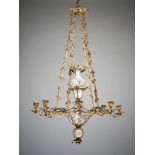 A Mid 19th Century French Ormolu and Opaline Chandelier Suspended by four stylized foliate chains