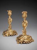 A Pair of 19th Century Rococo Revival Candlesticks in the manner of J. A. Meissonier, of Louis XV