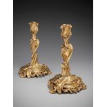 A Pair of 19th Century Rococo Revival Candlesticks in the manner of J. A. Meissonier, of Louis XV