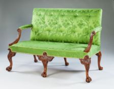 A George II Carved Walnut Settee, Possibly by Giles Grendey the scrolling arm supports finely carved