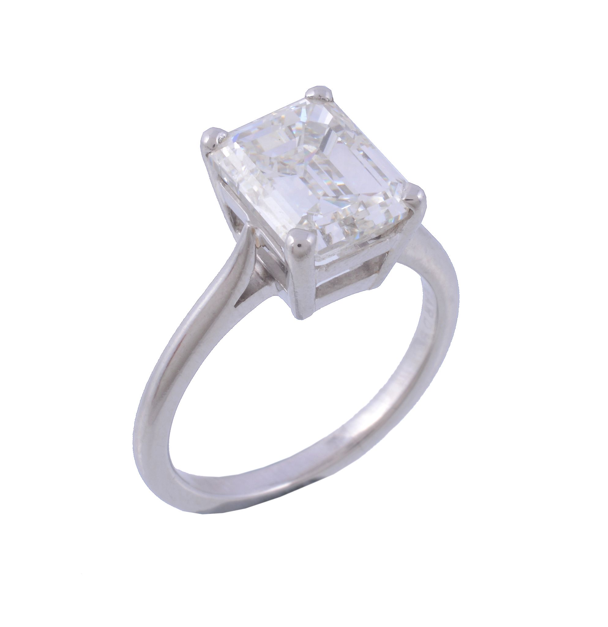 A diamond single stone ring , the step cut diamond weighing 4 A diamond single stone ring , the step