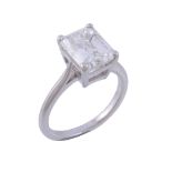 A diamond single stone ring , the step cut diamond weighing 4 A diamond single stone ring , the step