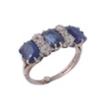 An 18 carat gold sapphire and diamond ring An 18 carat gold sapphire and diamond ring, the three