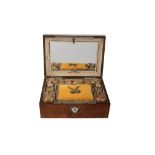 A French amboyna travelling toilet case with silver gilt mounted fittings A French amboyna